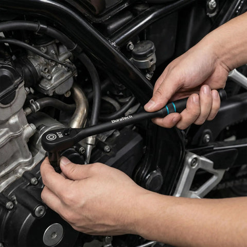 Work Horse 3/8 Inch Drive Ratchet Wrench With Extra Long Handle And 90 Tooth Gearing used for motorcycle repair, showing hand applying torque.