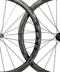 700C Road Bike Carbon Wheelset With 40mm UD X Weave Aero Rims And Rim Brake Surface, intersecting wheels close-up view