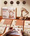 3D Wooden Harp Music Box Kit For Adults partially assembled, showing components and packaging on a table.