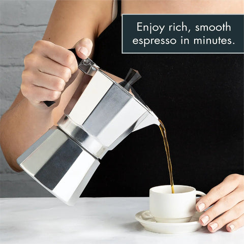 Woman pouring espresso from Stovetop Moka Pot Espresso Maker For Home Brew 6 Cup Greca Style Coffee Pot into cup