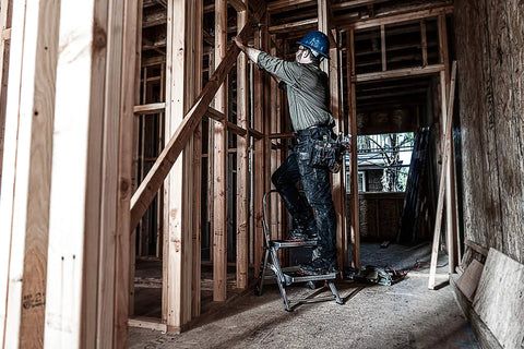 Worker using Lightweight Aluminum 2 Foot Grab And Go Safety Step Stool With Handy Handrail 300 Lb Rating 2 Step Design Type 1A in construction