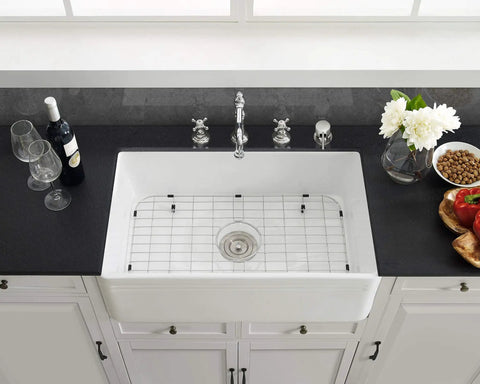 Stainless Steel Kitchen Sink Grid 25 x 13, Rubber Footed, Center Drain Compatible, Protects Sink Base From Scratches, in white sink.