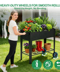 Woman pushing tall raised garden bed on wheels with extra wide 37.4 inch by 15.7 inch planting box, metal planter for veggies, herbs, flowers, with storage shelf and handle on patio or balcony.