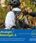 Adventure Medical Kit Ultralight/Watertight First Aid Kit .5 orange inserted into a hiker's backpack pocket outdoors