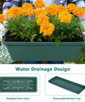 Close-up of planter box with marigolds from Two Column Vertical Raised Garden Bed With Six Planter Boxes, showing drainage holes and tray.
