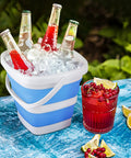 2 Pack Collapsible Buckets 5L 1.3 Gallon Portable Cleaning Bins in blue used as ice bucket with drinks outdoors