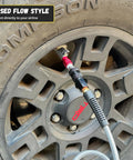 Lightning S2 Quick Connect Tire Air Chuck 1 Quarter Inch F-NPT Closed Flow Self Locking Nozzle attached to Schrader valve on car tire
