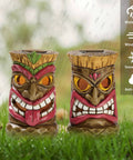 Tiki Head Garden Decor With Solar Outdoor Light Set Of 2 Tropical Hawaiian Resin Yard Sculptures Tiki Torch Statues For Patio Or Lawn Colorful Outdoor Decor Great Holiday Gift 6 Inches shown in an outdoor setting