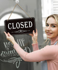 Woman holding Open Closed Sign For Biz 12x6.7 Inches Waterproof Double Sided Hanging Sign That Says Come In Or Closed With Hours Flip