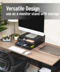 Two Drawer Coffee Pod Organizer With Removable Dividers Fits Up To 72 Pods Or Mix Of Pods And Office Essentials, Metal Mesh Coffee Station Base With Guided Drawer Track For Smooth Opening, Black Finish used as a monitor stand on a desk.
