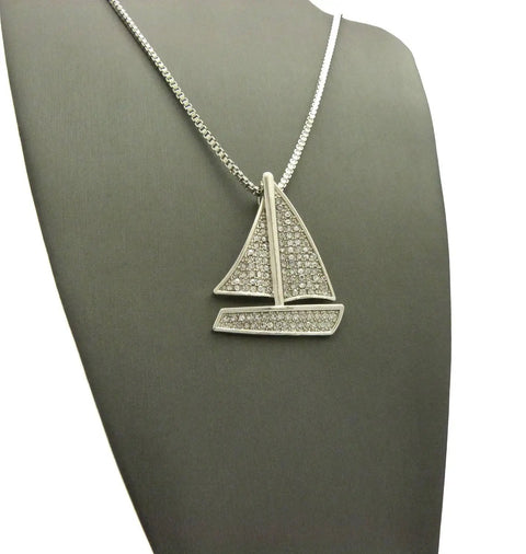 Iced Out Sailing Yacht Pendant Necklace With 24 Inch Chains In Silver Tone, Choose 2mm Box Chain, 3mm Cuban Chain, Or 2mm Rope Chain, 1.25 By 1.65 Inch Pendant, Imitation Silver Plated Fashion Jewelry displayed on a mannequin