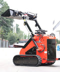 Mini Skid Steer Loader With Rotary Plow Tiller Attachment 1800lbs Capacity parked on pavement