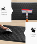 2-Piece Cushioned Anti-Fatigue Kitchen Mats for Floor Waterproof Non-Slip Comfort Standing Rugs Built for Long Kitchen Shifts in Black 17.3x28 Inches Each shown being cleaned with a vacuum and cloth.