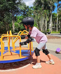 Child wearing Adult And Kid Skating Protective Gear Set With Vented Helmet And Adjustable Straps, playing on playground