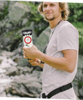 Person holding Orienteering Compass Ruler Navigation Tool For Hiking And Camping with High Precision Dial and Luminous Coating