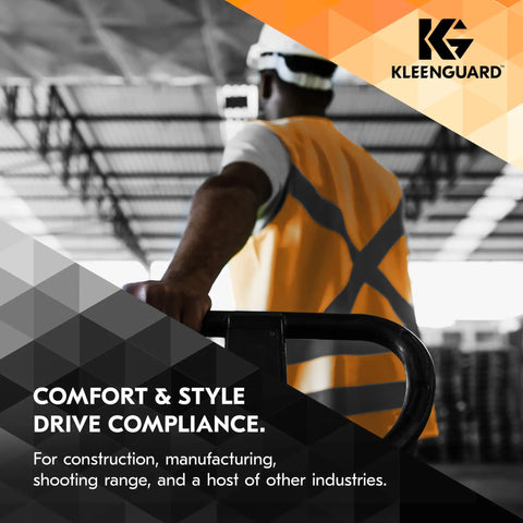 Worker wearing orange safety vest in industrial setting holding machinery with KleenGuard logo