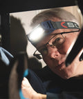 Man using Rechargeable COB LED Headlamp With Panoramic Beam Touchless On Off Sensor 400 Lumens Lightweight Work Light