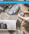 Built Tough Plastic Storage Bins With Lids 3 Pack Of Rock Solid Stackable Collapsible Containers organizing clothing and books.