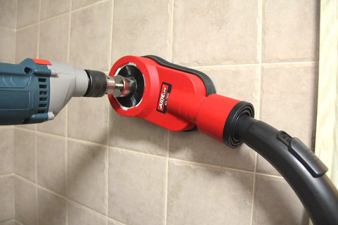 Rotary Hammer Dust Collection Attachment With Universal Dust Shroud For Drilling, mounted with drill, on tiled wall