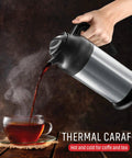 Pouring tea from Insulated Stainless Steel Coffee Carafe Thermos 24 Oz Twin Pack With Milk Server On The Go Portable Hot Or Cold