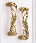 Peacock decorative brass door handles in antique gold for interiors