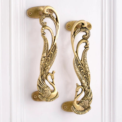 Peacock decorative brass door handles in antique gold for interiors
