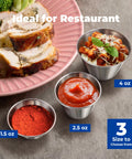 12 Pack One And A Half Ounce Stainless Steel Dipping Sauce Cups Reusable Metal Ramekins Commercial Grade Condiment Bowls Individual Portion Cups Small Round Au Jus For Home And Restaurant next to a plate with food and various sauces.