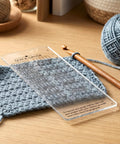 Quick Gauge Ruler For Knitting And Crochet No Sweat Stitch Measurement Tool with clear grid layout on a blue crochet swatch.