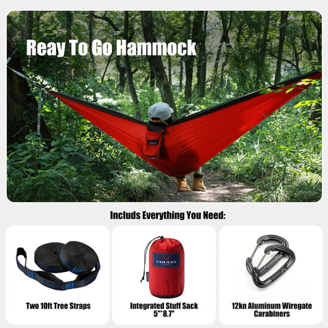 Person in red hammock surrounded by forest, featuring Double Camping Hammock With Tree Hanging Kit And 12Kn Aluminum Wiregate Carabiner.
