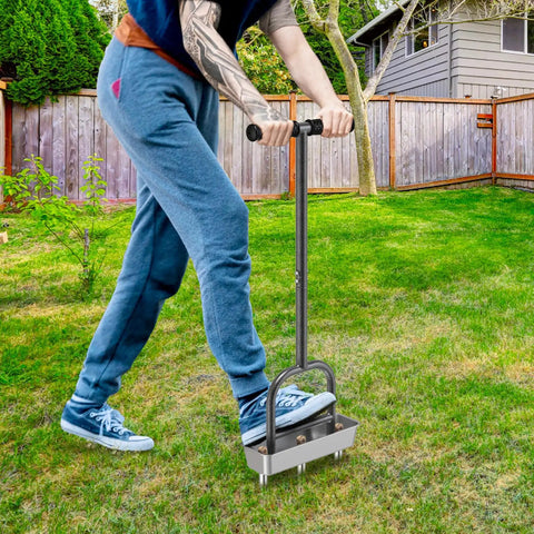 Person using Pre Assembled Manual Lawn Aerator With Three Stainless Steel Core Plugs And Soil Core Storage Tray on green lawn.