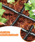 1/4 Inch Drip Irrigation Cross Fittings Barbed 4-Way Tee Connectors Kit for 1/4 Inch Tubing installed in a garden