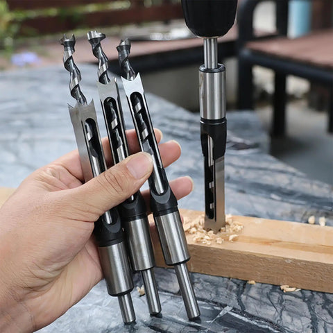 Heavy Duty Seven Piece Square Hole Drill Bit Set Forged From Heat Treated Hss Steel With Smooth Operator Mortise Chisel Edges quarter to three quarters inch shown in hand.