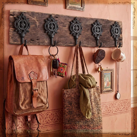 Six Pack Rock Solid Cast Iron Wall Hooks With Rustic Indian Leaf Design Heavy Duty Matte Black Finish displaying bags and keys.