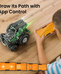 Child controlling Totally Fun 727-Piece 5in1 Robot Car Kit with smartphone app on wooden table