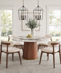 Built Different 53 Inch Round Dining Table Featuring Removable Lazy Susan Gold Ring Faux Marble Top with decor and chairs.