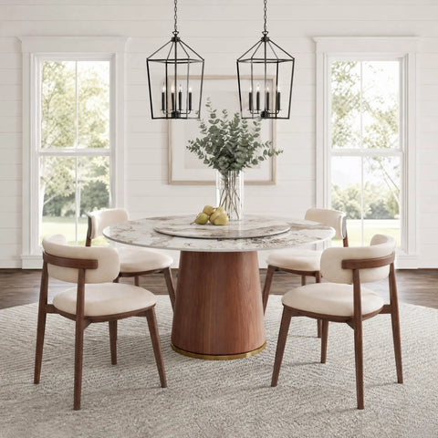Built Different 53 Inch Round Dining Table Featuring Removable Lazy Susan Gold Ring Faux Marble Top with decor and chairs.