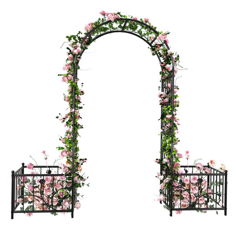 Garden Arbor With Planter Boxes 76 Inch Wide By 86 Inch High Black Metal Archway For Climbing Plants Outdoor Lawn Patio And Backyard Wedding Ceremony Entrance adorned with pink flowers.