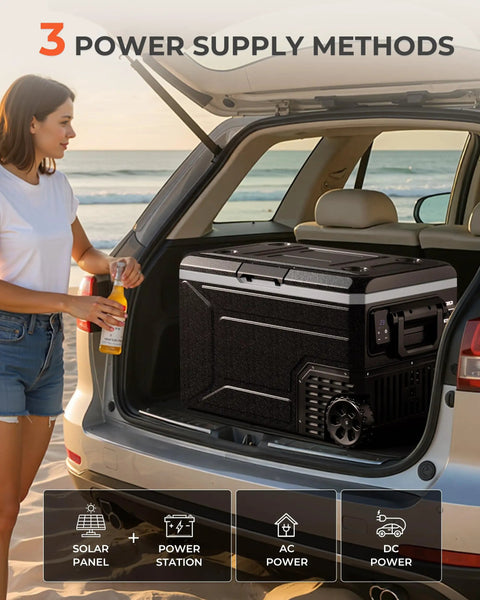 Massive 69 Quart 12V Portable Refrigerator And Freezer Cart Riding On Tough Off Road Wheels in car trunk with power options.