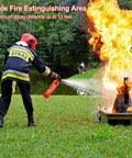 Firefighter using a fire extinguisher with a 13ft spray to extinguish a controlled fire outdoors, emphasizing wide extinguishing area.