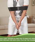Man using 2 In 1 Golf Grip Trainer And Swing Stabilizer With Arm Band For Correct Grip And Arm Positioning Fixes Grip Posture And Locks Elbow For Consistent Shots Pro Level Golf Accessory For Men And Women indoors