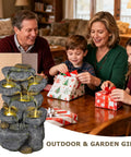 Family sitting at a table with Solar Powered 5 Tier Rock Water Fountain With LED Lights displayed, gift wrapping around.
