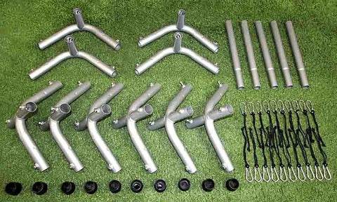 Parts of Outdoor Indoor Batting Cage Frame Kit 55 X 14 X 12 Inches With 1-1/2 Inch Steel Frame Corners laid out on grass