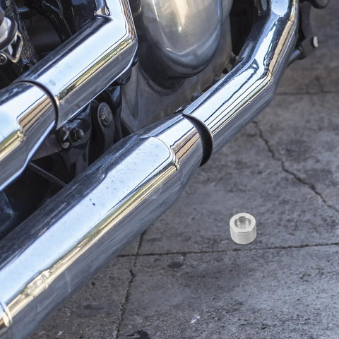 Two Piece Motorcycle Cam Chain Tensioner Adjuster Kit For Suzuki Cruisers showing steel regulator near chrome exhaust.