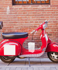 Waterproof Outdoor Outlet Box Cover For Charging Stations Featuring Hella Tough Pp Shield And Quick Install Setup To Keep Your Power Plugs Clean And Weather Ready Year Round on a red scooter.
