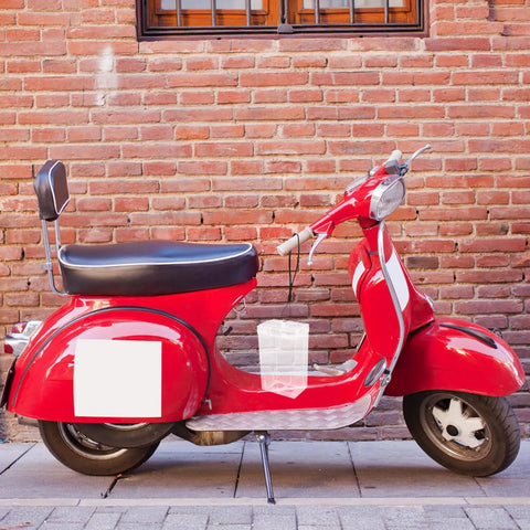 Waterproof Outdoor Outlet Box Cover For Charging Stations Featuring Hella Tough Pp Shield And Quick Install Setup To Keep Your Power Plugs Clean And Weather Ready Year Round on a red scooter.