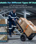Sturdy Electric Stair Climbing Dolly With A Beefy 1500 Watt Motor Making No Sweat Moves On Steps For Quick Transport Of Appliances And Heavy Couches In Black, shown on wooden staircase.