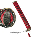 Close-up of Hand Sharpened 1060 High Carbon Steel Samurai Sword Showpiece with dragon-design alloy fittings and dark red ito.