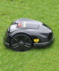 Smart Automatic Robotic Lawn Mower With Self Charging And Rain Avoidance on grass, black exterior, side view