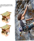 Beefy Two Pack Heavy Duty Sliding Door Pulley Block with Steel Wheel next to climber on rock face, for gates and shutters.