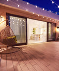 Two Pack Farmhouse Porch Lights Outdoor Wall Sconces Set With Globular Seeded Glass In Rustic Bronze Exterior Wall Mount Lanterns For Porch Patio Or Garage, Classic Farmhouse Style, Each Max 40W illuminating a nighttime patio scene.